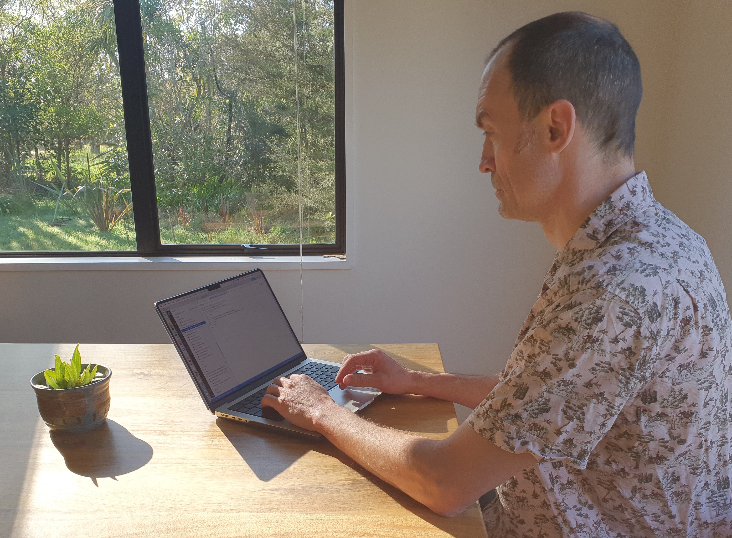Chris Toynbee working at a laptop